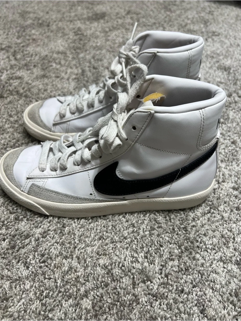 Nike White High-Top Sneakers with Black Swoosh